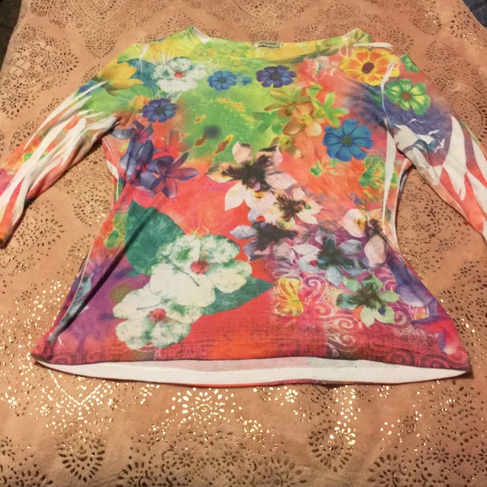 It’s a multi colored shirt size large